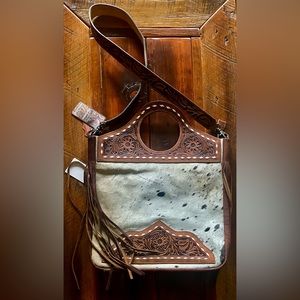 Cowhide and fringe purse